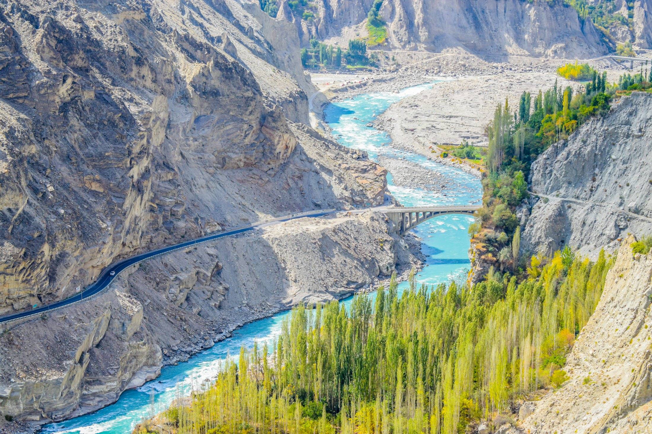 A glacial river cutting through mountain valleys in northern Pakistan