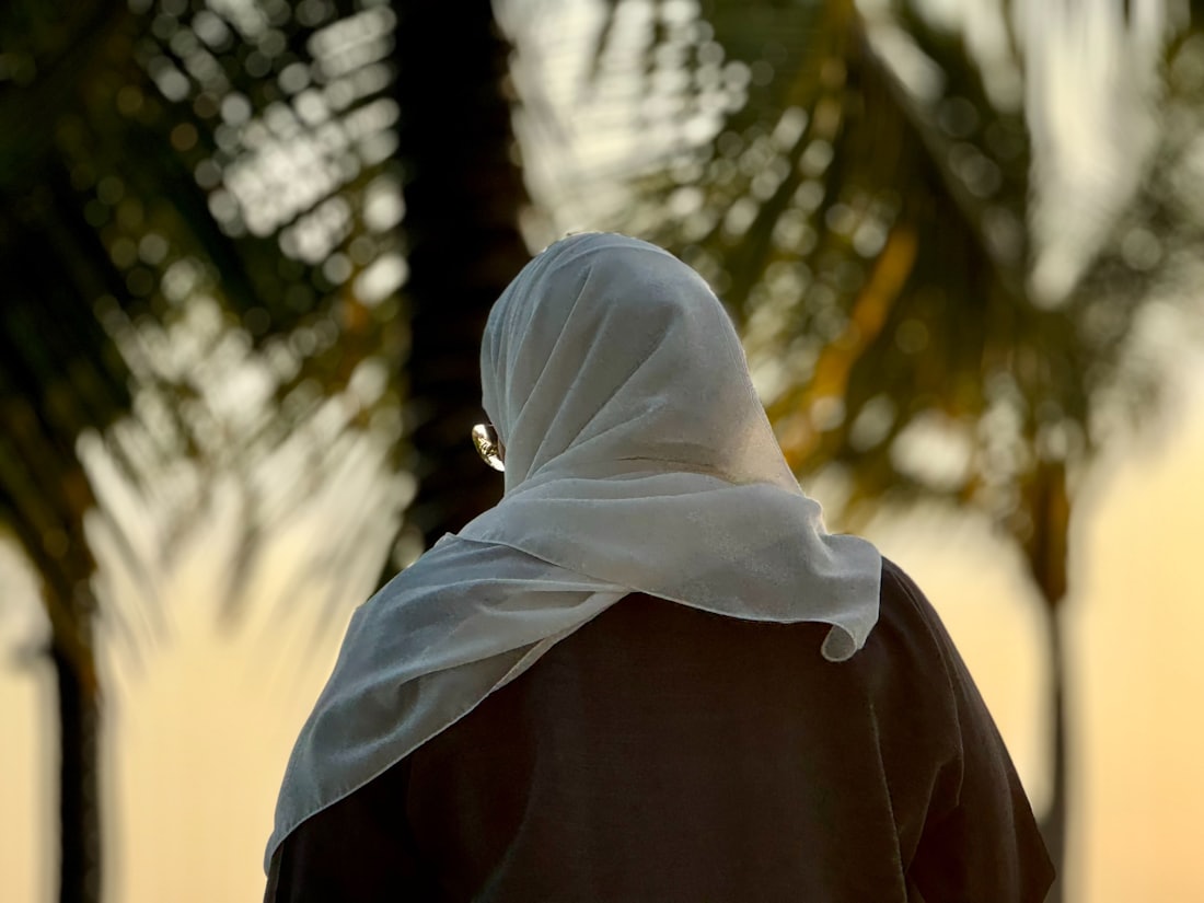 A woman in a white headscarf